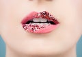 Beautiful female lips closeup. Perfect female mouth with glitter lipstick makeup, pink tint and white teeth