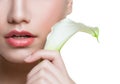 Beautiful female lips with natural color lipgloss and white lily calla flower isolated