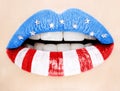 Beautiful female lips painted with American flag