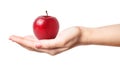 Beautiful female manicured hand holding a perfect red apple with water drops Royalty Free Stock Photo