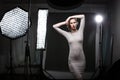 Beautiful female model posing in a photographic studio