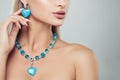 Beautiful female model with turquoise jewelry necklace