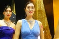 Beautiful female models show gold jewelry at the Shenzhen International Jewelry Show