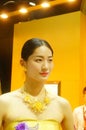 Beautiful female models show gold jewelry at the Shenzhen International Jewelry Show