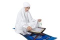 Beautiful female muslim read Kuran - isolated Royalty Free Stock Photo