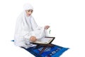 Beautiful female muslim reading Quran on white Royalty Free Stock Photo