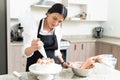 Beautiful Female Pastry Chef Preparing Cake At Home Royalty Free Stock Photo