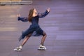 Beautiful female performer dancing on roller skates