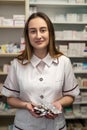 female pharmacist checking stock prescriptions medicine packages medicine boxes Royalty Free Stock Photo