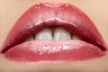 Beautiful female with pink shiny lips close up Royalty Free Stock Photo