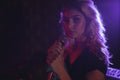 Beautiful female singer performing in nightclub Royalty Free Stock Photo