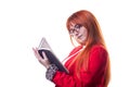 Beautiful female student in glasses in red business suit with notebook in hand Royalty Free Stock Photo