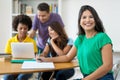 Beautiful female student with group of multi ehtnic students Royalty Free Stock Photo