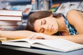 Beautiful female student in a library Royalty Free Stock Photo