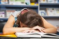 Beautiful female student in a library Royalty Free Stock Photo