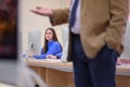 Beautiful female it student listening her professor during computer lab class. Education and technology concept Royalty Free Stock Photo