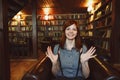 Beautiful female student in a university library Royalty Free Stock Photo