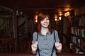 Beautiful female student in a university library Royalty Free Stock Photo