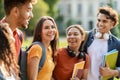 Beautiful Female Student Walking With College Friends Outdoors Royalty Free Stock Photo