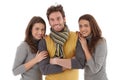Beautiful female twins embracing handsome man Royalty Free Stock Photo