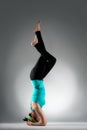 Beautiful yoga teacher making fitness posture