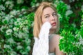 Beautiful feminime woman with white wings with white spring flowers.