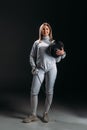 Fencer looking at camera while holding