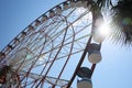 Beautiful Ferris wheel against blue sky on sunny day, low angle view Royalty Free Stock Photo