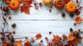 Festive Autumn Decor with Pumpkins, Berries, and Leaves on White Wood Background - Thanksgiving Day or Halloween Flat Lay with Royalty Free Stock Photo