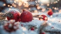 Festive Baubles on Snow with Fir Branches and Defocused Snowfall in Background - Abstract Christmas Card Royalty Free Stock Photo