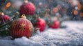 Festive Baubles on Snow with Fir Branches and Defocused Snowfall in Background - Abstract Christmas Card Royalty Free Stock Photo
