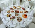 Beautiful festive table served for wedding celebration dinner at home or restaurant interior. Table full of food at a restaurant. Royalty Free Stock Photo