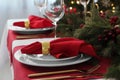 Beautiful festive table setting with Christmas decor indoors Royalty Free Stock Photo