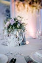 Beautiful festive table setting with elegant white flowers and cutlery, dinner table decoration