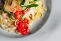 Fettuccine pasta with tomato and cheese in plate. Royalty Free Stock Photo