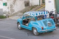 Beautiful Fiat 600 vintage blue cabriolet in the historic center of Porto Ercole, Tuscany, Italy