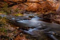 Beautiful Fiery Fall Foliage on the Falls of the Guadalupe River, Texas.