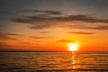 Beautiful fiery sunset sky on the beach.