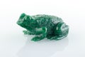 Beautiful figurine of a toad made of malachite on a white background