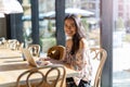 Beautiful Filipino woman using laptop at cafe Royalty Free Stock Photo