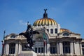 Beautiful Fine Arts Palace of Mexico City in Mexico with the flags and statue in front of it