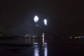 Beautiful firework on night sky in tromsoe city with bridge, cathedral and colorful reflection on the cold fjord water Royalty Free Stock Photo