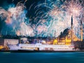 Beautiful fireworks above public ferry and old district of Istanbul