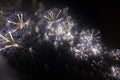 Multiple Fireworks in night sky in a composition in shades blue and white Royalty Free Stock Photo