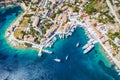 Beautiful Fiscardo village at Kefalonia or Cephalonia Island. Yachting bay and a ferry ship in the port Royalty Free Stock Photo