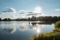 Beautiful fish pond in Badin, near Banska Bystrica, Slovakia. Fishing place. Blue sky and clouds over the lake. Mirror reflection Royalty Free Stock Photo