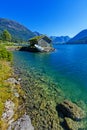 Beautiful fishing house on fjord. Beautiful nature with blue sky, reflection in water and fishing house. Norway Royalty Free Stock Photo