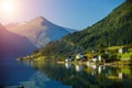 Beautiful fishing houses on fjord. Beautiful nature with blue sky, reflection in water and fishing house. Norway