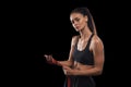 Beautiful and fit female fighter getting prepared for the fight or training Royalty Free Stock Photo