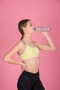 SPORTY FITNESS GIRL HOLDING BOTTLE OF WATER Royalty Free Stock Photo